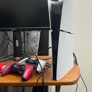 White and Black Gaming Console with Controllers